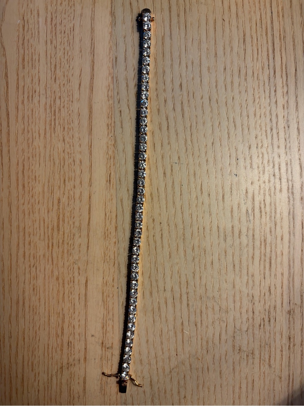 Faux diamond and gold tennis bracelet